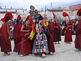 Mustang Lo Manthang Tiji Festival Day 3 09-1 Dorje Jono And Monks At The Granary Dorje Jono then leads the monks to the granary outside the main gate of Lo Manthang near the end of day three of the Tiji festival.